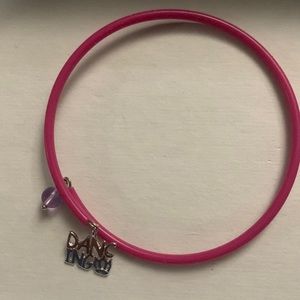 Sterling silver charm dancing on pink bangle